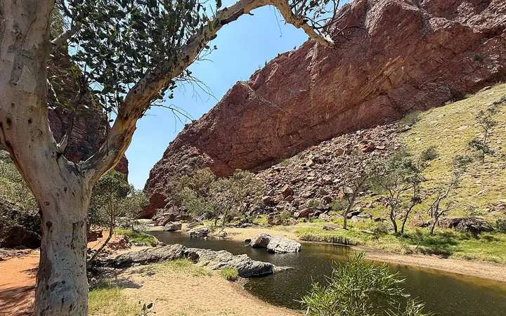 The waterhole and red cliffs at Simpsons Gap