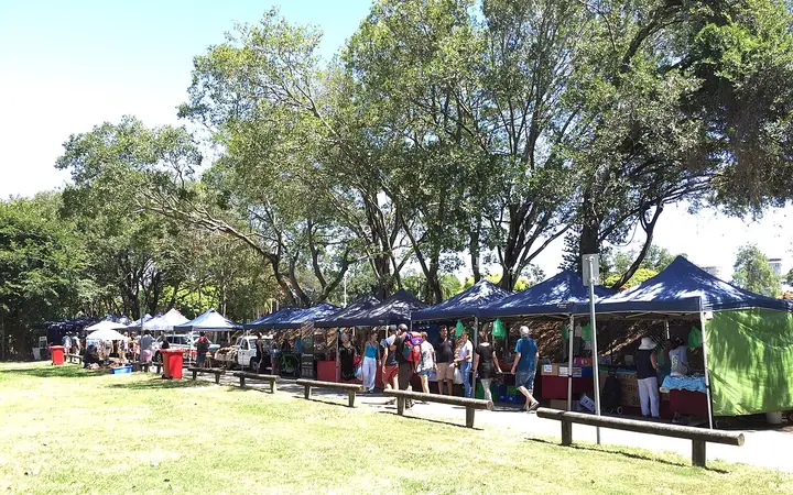West End Markets stalls under the trees in Davies Park