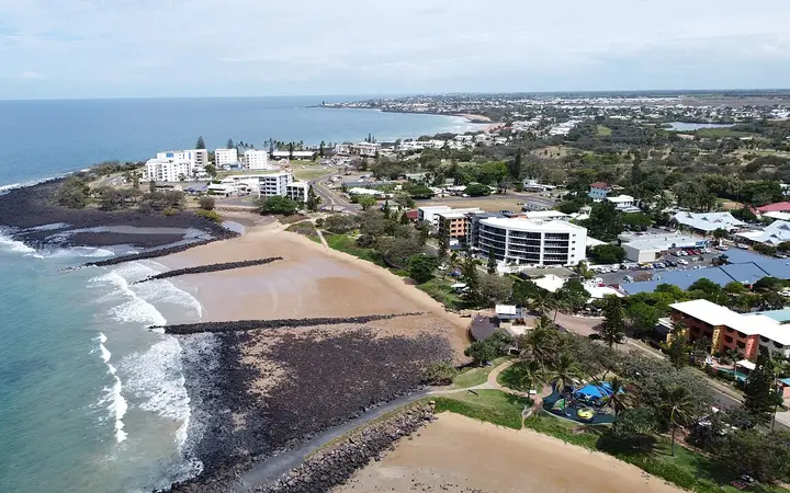 Bargara's basalt shoreline and rock-walled Basin from the air