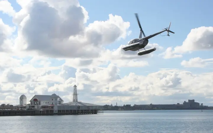 A joyflight helicopter over Corio Bay by Cunningham Pier