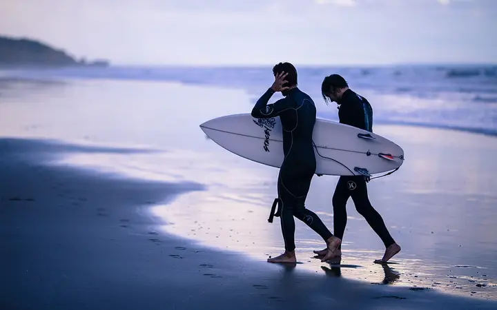 Surfers on the beach at Torquay