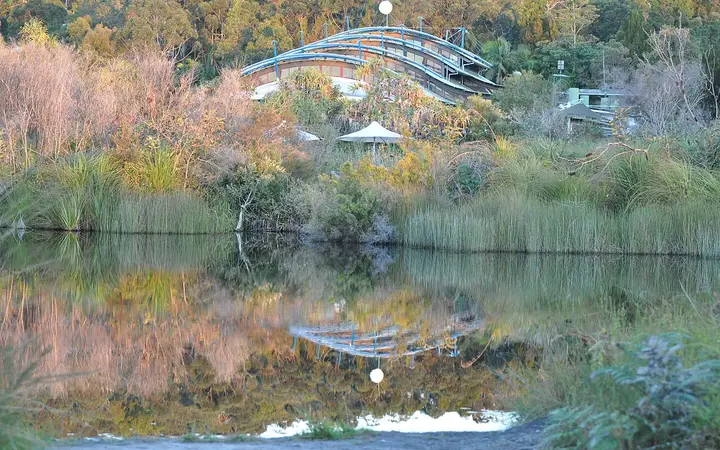 Kingfisher Bay Resort on K'gari, reflected in a lagoon