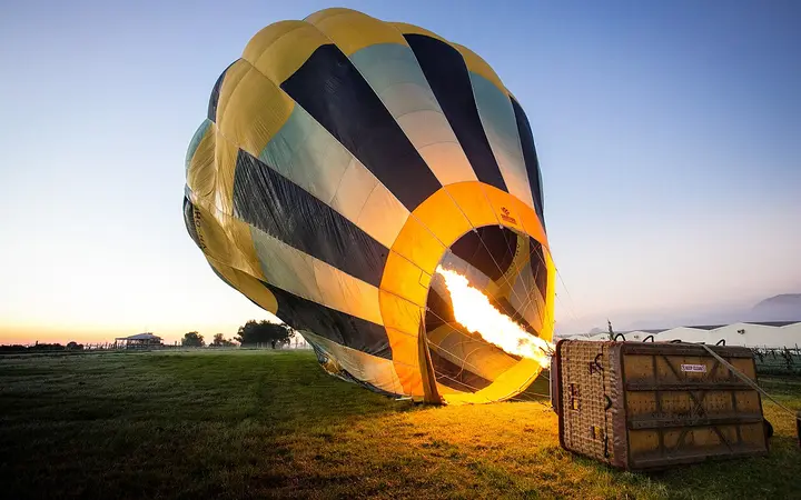 A balloon inflating at dawn in Pokolbin