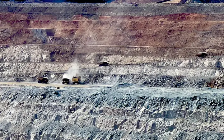 Haul trucks on the Super Pit terraces