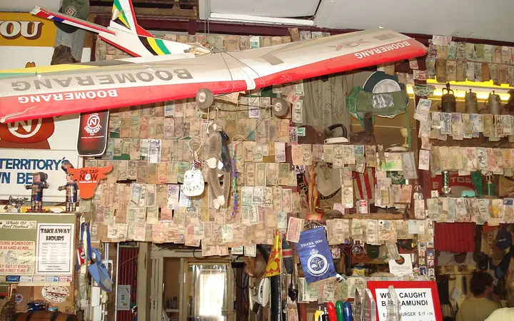 Traveller memorabilia over the bar at Daly Waters