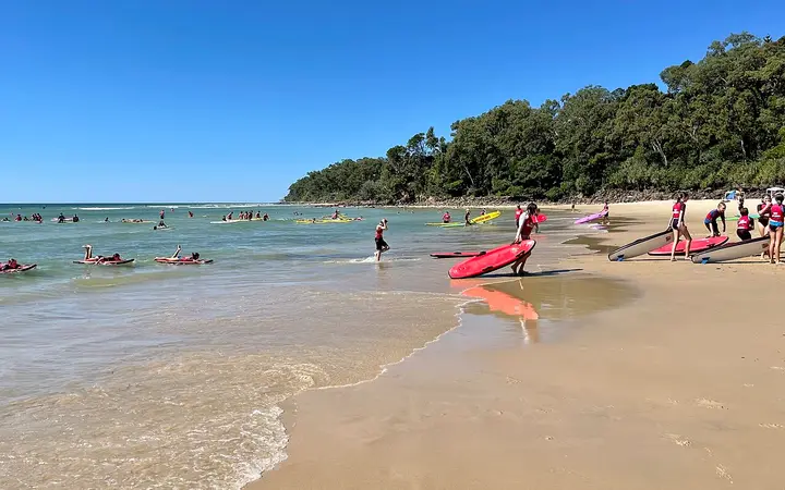 Learners on soft boards at Noosa Main Beach