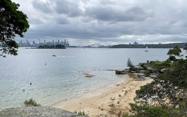 Milk Beach on the Hermitage Foreshore walk, with the Harbour Bridge beyond