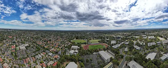 Aerial panorama of Burwood East reserve facing the city skyline. March 2023.