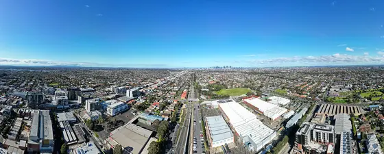 Aerial panorama of Preston facing west towards the Melbourne skyline. July 2023.