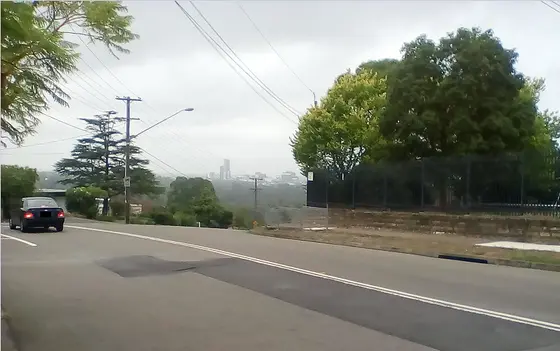 Winston Hills (New South Wales) at Oakes Road with Parramatta Skyline in distance.